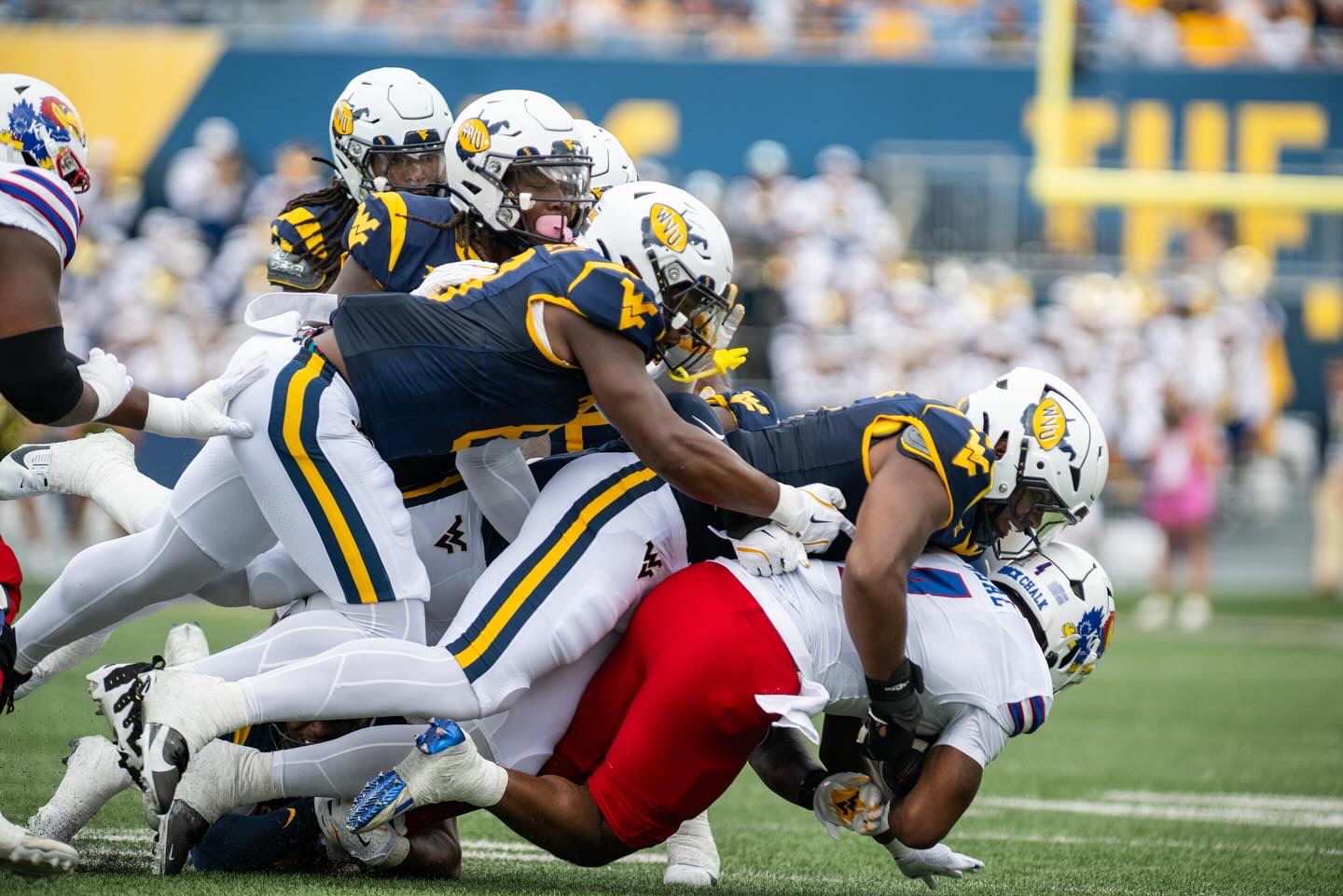 Garrett Greene leads late rally, West Virginia upends Kansas